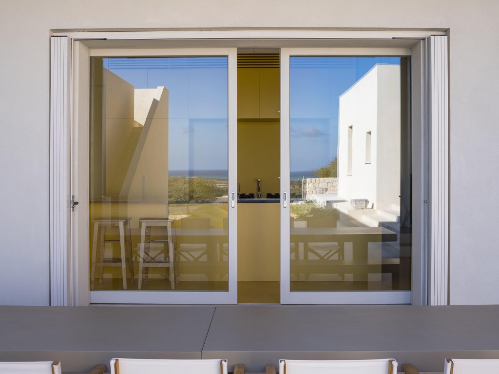 Villa in Sicily / Reflection of patio in sliding doors