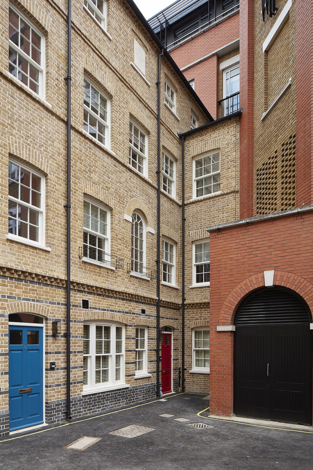 Replacement homes on Dean's Mews, London / London family homes