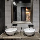ThirtyEight, Summertown Oxford / Main bathroom with black painted walls and dark polished plaster in contrast to the light and airy bar and dining room