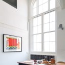 Old School House, East London / Dining room area showing double height space