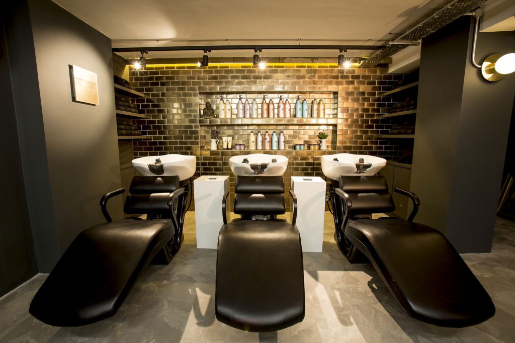 George Northwood's Hair Salon, Fitzrovia / Basement backwash showing glazed, gold tiles behind