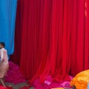 South Asian Gallery / Touchstone image of newly dyed fabric drying on bamboo frames