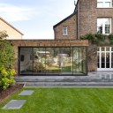 St Margaret's House / Expansive glazing opens onto a beautiful garden.