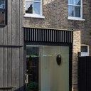 Charred House / Charred House - Pivot Door & Charred Timber Fins
