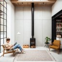 Gin Distillery / The living space centres on the wood burner and large crittall window