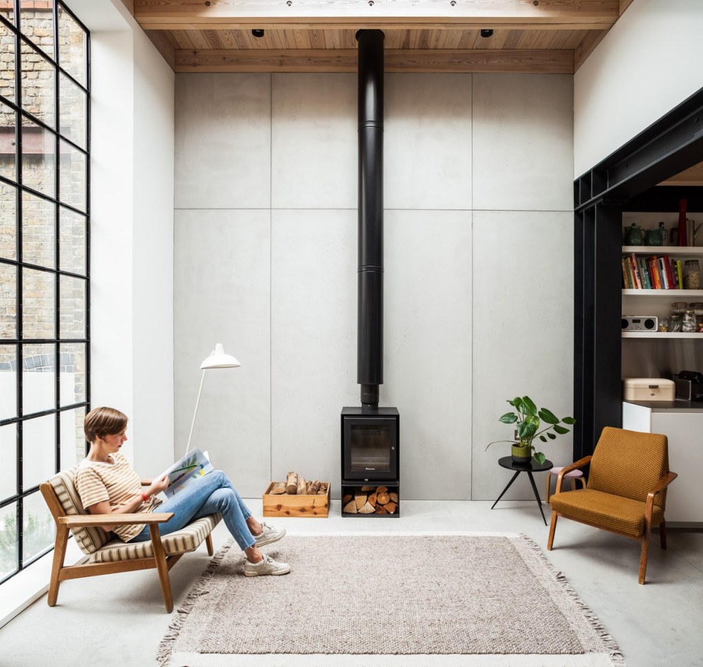 Gin Distillery / The living space centres on the wood burner and large crittall window