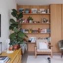 The Coach House / Bespoke oak shelving in the living area