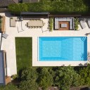Coast House / Coast House Aerial view of Garden swimming pool and entertainment spaces