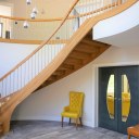 Littleover New Build / Double height entrance hall with bespoke curved staircase