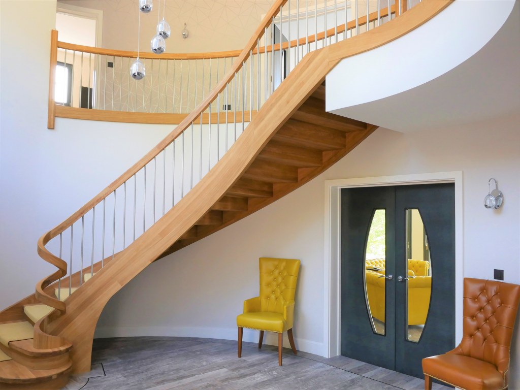 Littleover New Build / Double height entrance hall with bespoke curved staircase