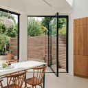 North London Victorian Villas / Large pivot door to garden